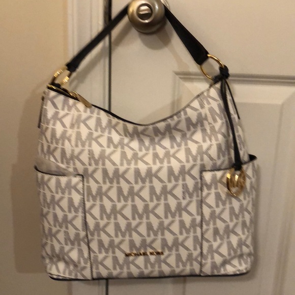 New with tags Coach and Michael Kors purses. - Picture 4 of 6
